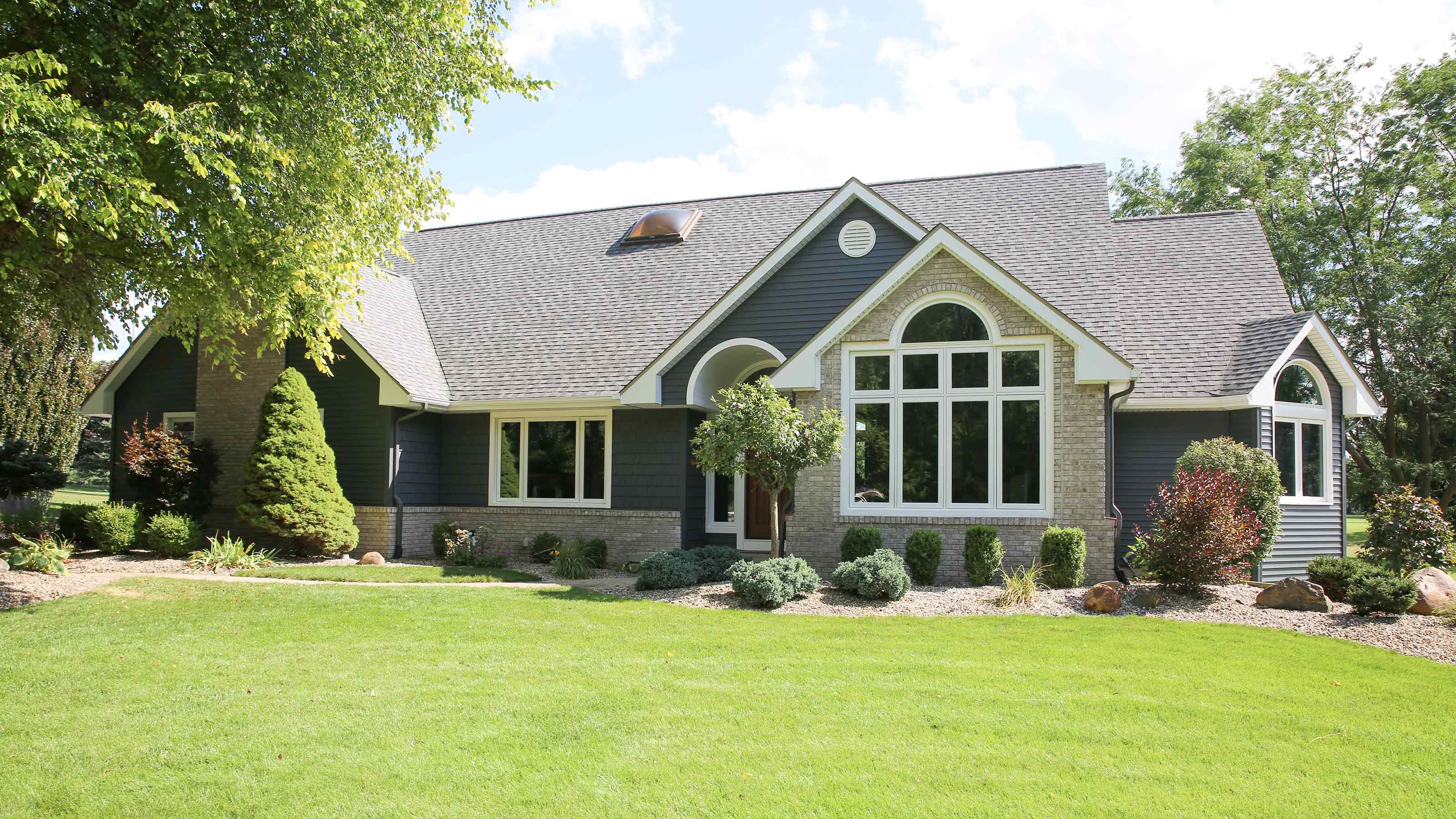 A beautiful home update with new windows, siding & trim from Lakeview Windows & Siding