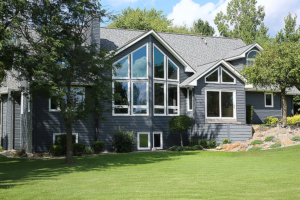 Home featuring large custom replacement windows and specialty window shapes