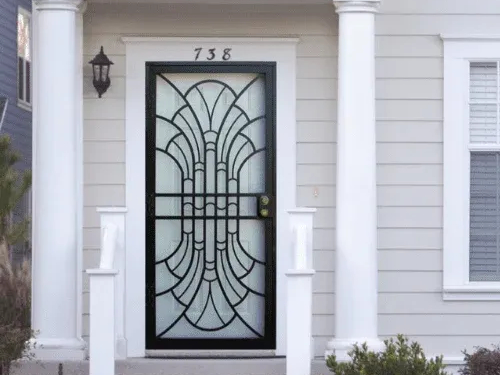 Security storm door with decorative steel grille